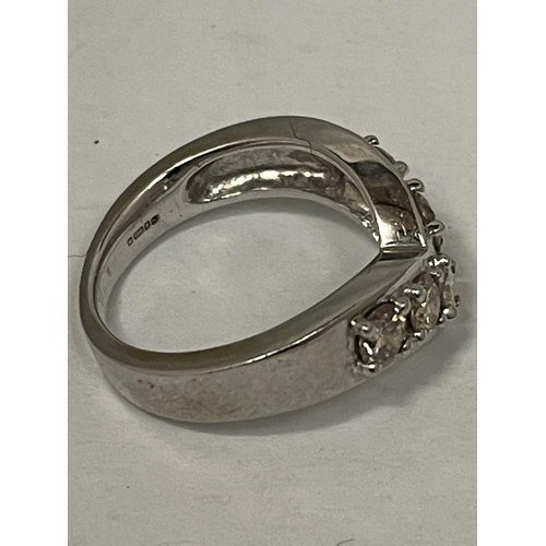 574 - AN 18 CARAT WHITE GOLD RING IN A WISHBONE DESIGN WITH FIVE IN LINE DIAMONDS SIZE M/N