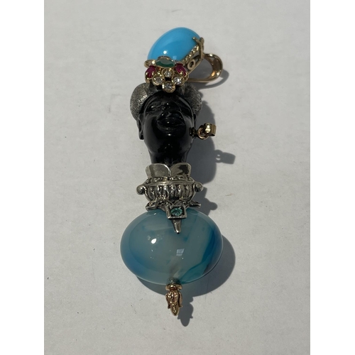 582 - A BLACKAMORE PENDANT OF AN AFRICAN TRIBAL FIGURE WITH RUBYS, EMERALDS AND TURQUOISE STONES BY LUIGI ... 