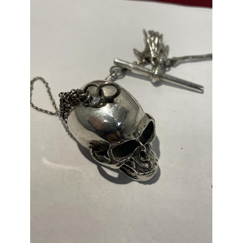 594 - A SILVER ALBERT CHAIN WITH LARGE SKULL FOB AND BONE, HAND ETC DESIGN