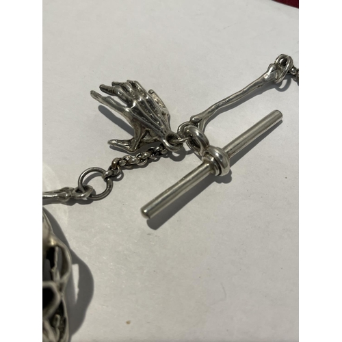 594 - A SILVER ALBERT CHAIN WITH LARGE SKULL FOB AND BONE, HAND ETC DESIGN