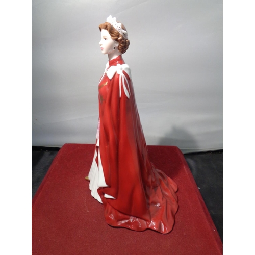 749 - A ROYAL WORCESTER FIGURINE OF HER MAJESTY THE QUEEN