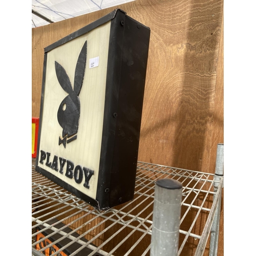 1220A - AN ILLUMINATED 'PLAYBOY' SIGN