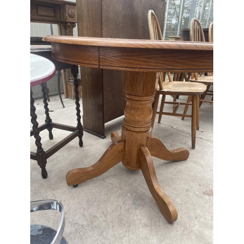 2110 - AN OAK CIRCULAR KITCHEN TABLE