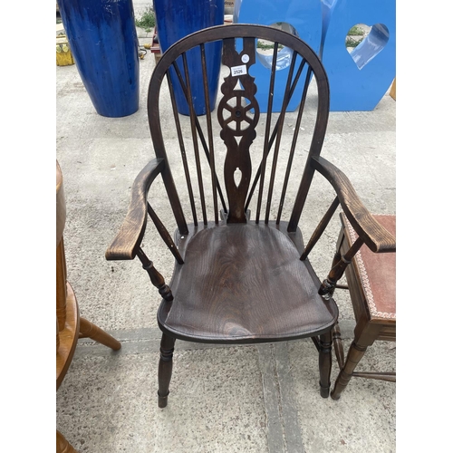 2526 - A WHEEL-BACK WINDSOR CHAIR AND PIANO STOOL