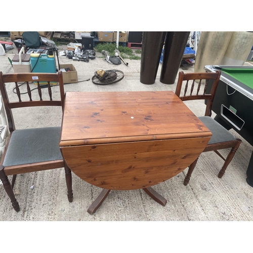 2531 - A PINE DROP-LEAF DINING TABLE AND TWO CHAIRS