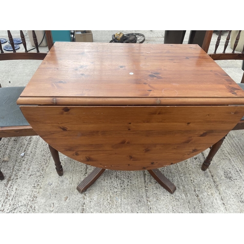 2531 - A PINE DROP-LEAF DINING TABLE AND TWO CHAIRS