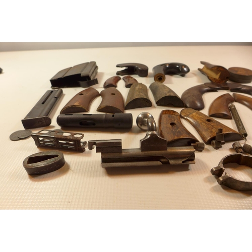 350 - A COLLECTION OF GUN PARTS, TO INCLUDE SETS OF WOODEN GRIPS, MAGAZINES,SPRINGS ETC