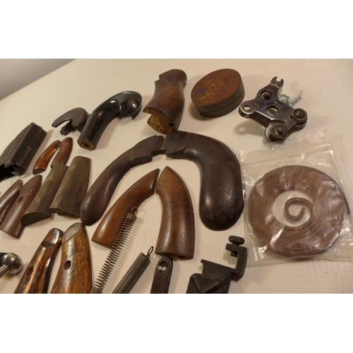 350 - A COLLECTION OF GUN PARTS, TO INCLUDE SETS OF WOODEN GRIPS, MAGAZINES,SPRINGS ETC