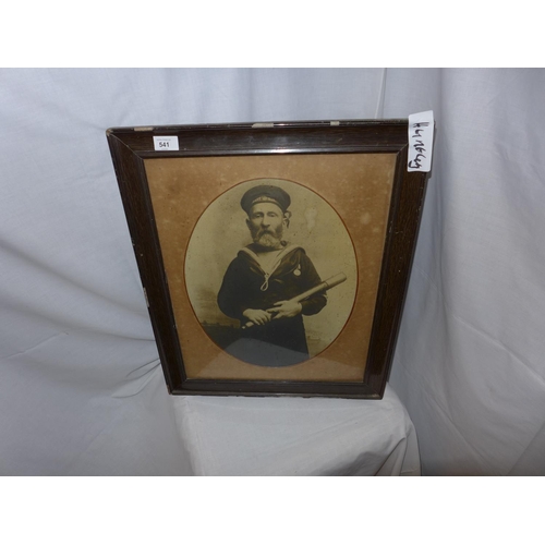 541 - AN EARLY 20TH CENTURY FRAMED BLACK AND WHITE PHOTOGRAPH OF A SAILOR