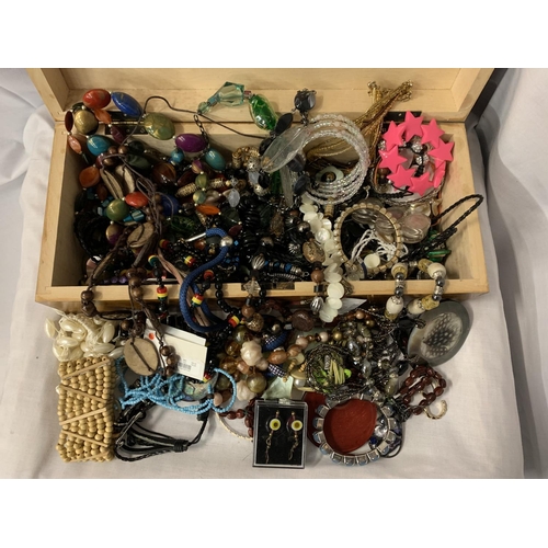 13 - A WOODEN BOX CONTAINING A LARGE QUANTITY OF COSTUME JEWELLERY