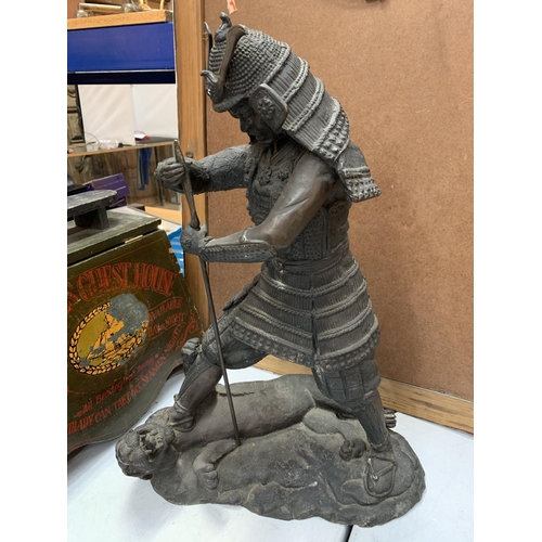 24 - A VERY HEAVY BRONZE FIGURE OF A SAMURAI WARRIOR