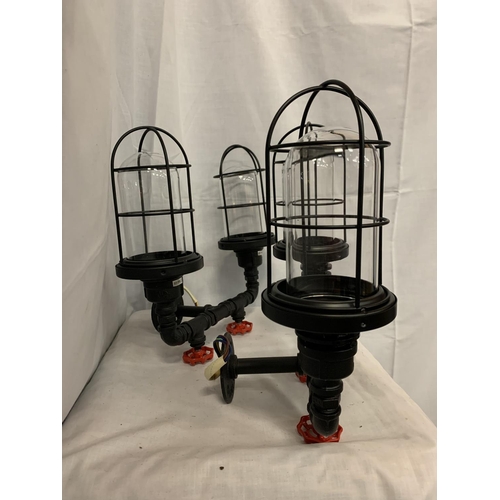 31 - A PAIR OF INDUSTRIAL STYLE TWIN WALL LIGHTS WITH CAGED SHADES AND STEAM PIPE WITH TAPS EFFECT