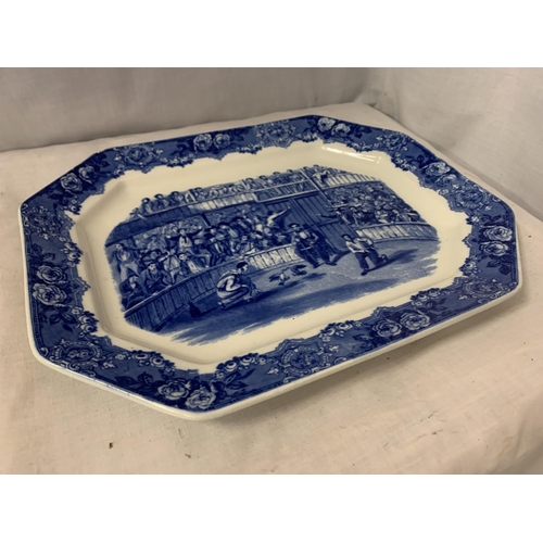 32 - A LARGE BLUE AND WHITE MEAT PLATTER DEPICTING COCK FIGHTING AND STAMPED SPANISH FESTIVITIES 1798