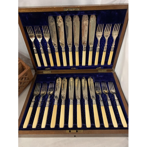 34 - A MAHOGANY AND BRASS INLAY CANTEEN OF CUTLERY WITH TWELVE SETS OF FISH KNIVES AND FORKS AND A LETTER... 