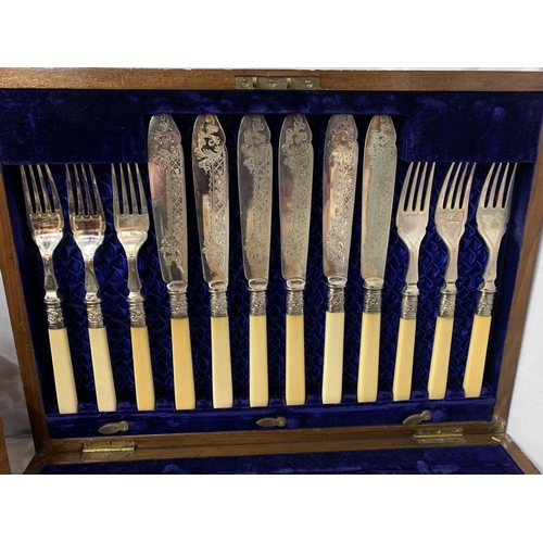 34 - A MAHOGANY AND BRASS INLAY CANTEEN OF CUTLERY WITH TWELVE SETS OF FISH KNIVES AND FORKS AND A LETTER... 