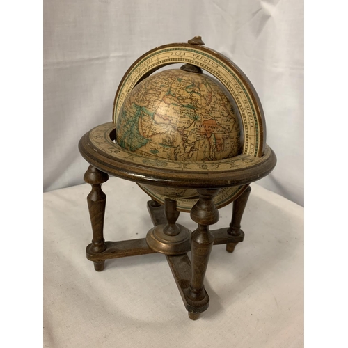 65 - A VINTAGE STYLE GLOBE ON A WOODEN STAND