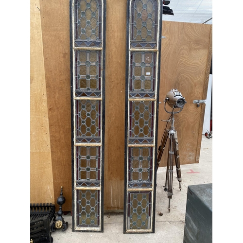 1202A - A PAIR OF TALL CAST IRON WINDOW FRAMES WITH LEADED STAINED GLASS WINDOWS (H:253CM) (SLIGHT DAMAGE TO... 