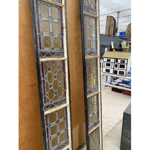 1202A - A PAIR OF TALL CAST IRON WINDOW FRAMES WITH LEADED STAINED GLASS WINDOWS (H:253CM) (SLIGHT DAMAGE TO... 