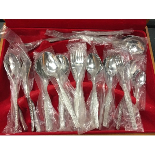 115 - A CANTEEN OF RETRO STYLE STAINLESS STEEL FLATWARE