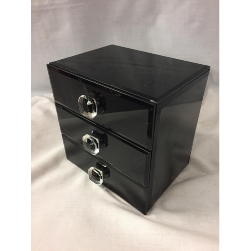 70 - A BLACK GLOSS THREE DRAWER JEWELLERY BOX