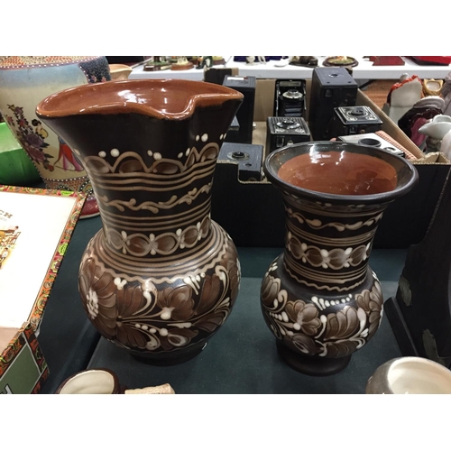 83 - A LARGE CERAMIC JUG AND VASE WITH EIGHT TOBY JUGS