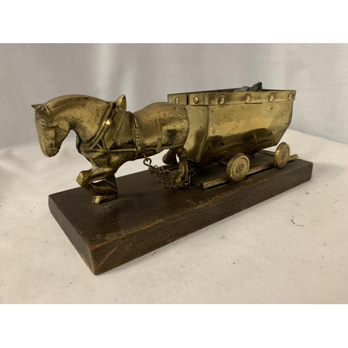 162 - A BRASS HORSE AND COAL WAGON ON A WOODEN BASE