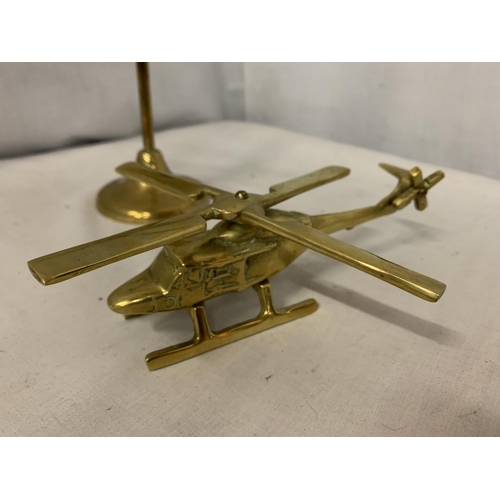 180 - TWO POLISHED BRASS HELICOPTERS WITH SPINNING BLADES