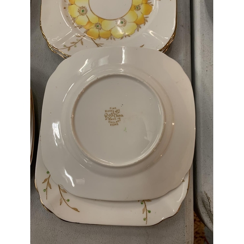 182 - AN COLLECTION OF ROSLYN FINE BONE CHINA IN A YELLOW FLORAL PATTERN WITH GOLD ACCENTED EDGES