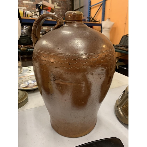 200 - A LARGE TREACLE GLAZE EWER