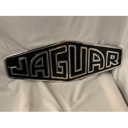 206 - A BLACK AND CHROME METAL JAGUAR WALL SIGN W:24