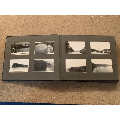 257 - A SMALL VINTAGE PHOTO ALBUM CONTAINING BLACK AND WHITE IMAGES