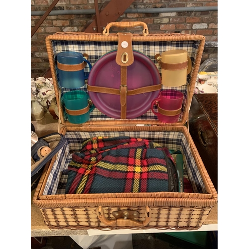 274 - A WOVEN PICNIC HAMPER INCLUDING PLASTIC CUPS, PLATES AND A BLANKET AND A SECOND PICNIC RUCKSACK TO I... 