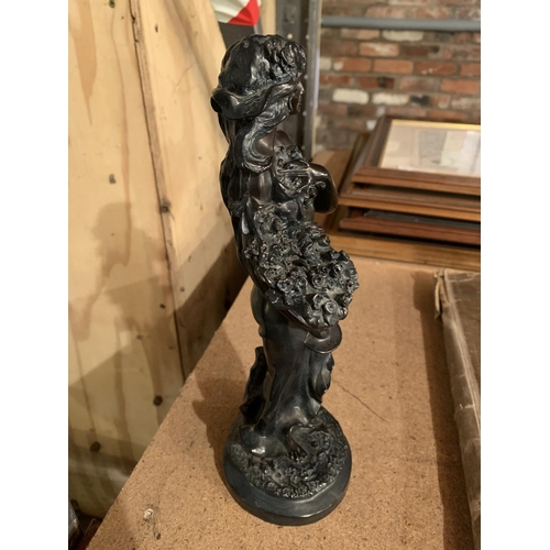 280 - A RESIN STATUE OF A YOUNG LADY HOLDING A VASE OF FLOWERS H: 28CM