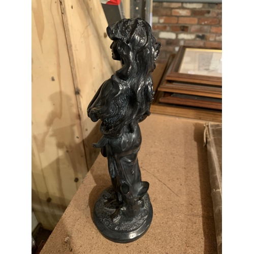 280 - A RESIN STATUE OF A YOUNG LADY HOLDING A VASE OF FLOWERS H: 28CM