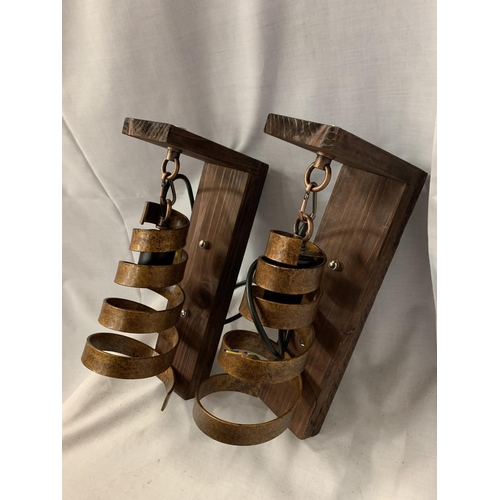 242 - TWO WOOD MOUNTED WALL LIGHTS WITH METAL SPIRAL BRONZE COLOURED SHADES