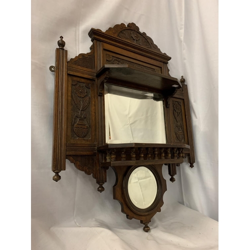 48A - AN ORNATE CARVED WALL HANGING WITH A RECTANGULAR AND A SMALLER MIRROR AND TWO SHELVES