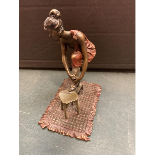 198 - AN ART DECO STYLE COLD PAINTED BRONZE OF A LADY WITH HER FOOT UP ON A STOOL