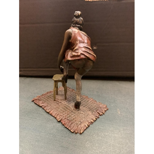 198 - AN ART DECO STYLE COLD PAINTED BRONZE OF A LADY WITH HER FOOT UP ON A STOOL