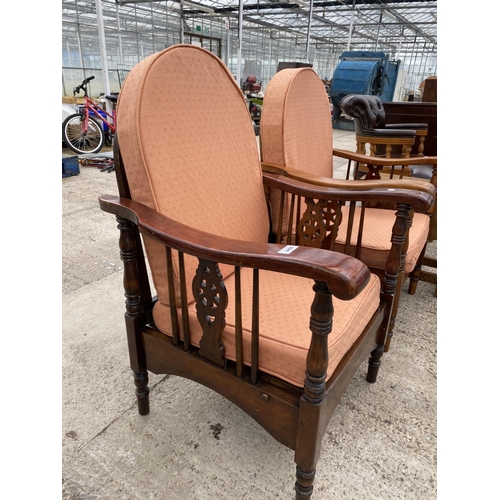 2459 - A PAIR OF MID 20TH CENTURY RECLINING CHAIRS WITH WHEEL BACKS