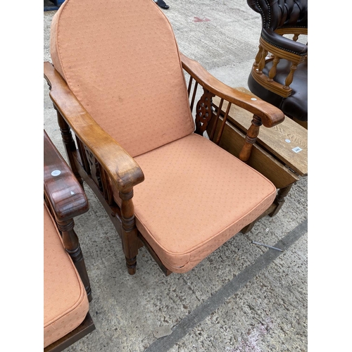 2459 - A PAIR OF MID 20TH CENTURY RECLINING CHAIRS WITH WHEEL BACKS