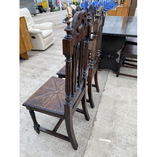 2470 - A PAIR OF JACOBEAN STYLE OAK HALL CHAIRS