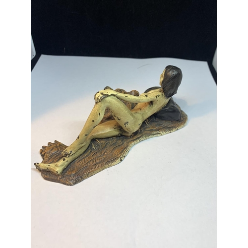 68A - A COLD PAINTED BRONZE FIGURINE OF A NUDE LADY LYING ON A TIGER RUG