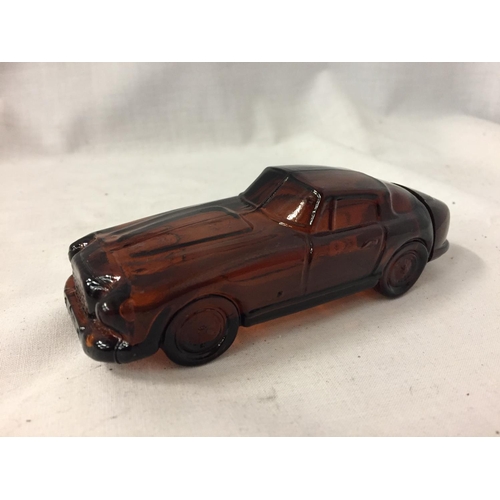 84 - AN AVON SCENT BOTTLE IN THE SHAPE OF A CAR