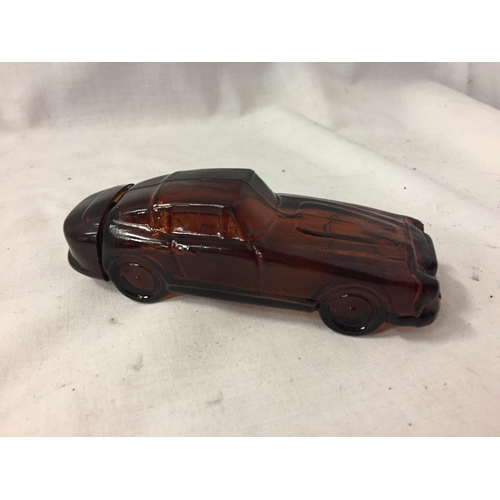 84 - AN AVON SCENT BOTTLE IN THE SHAPE OF A CAR