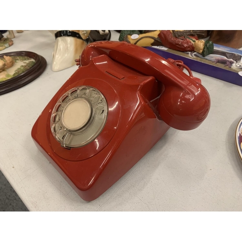 140 - A RETRO RED DIAL UP TELEPHONE IN RED