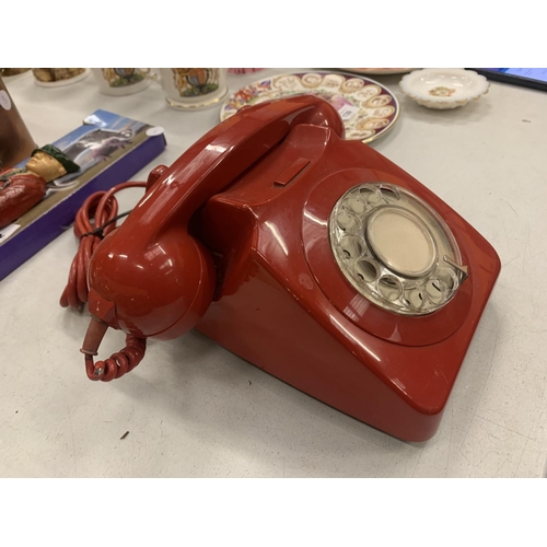 140 - A RETRO RED DIAL UP TELEPHONE IN RED