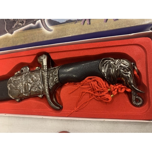 142 - A BOXED ORNATE KNIFE IN AN ELEPHANT DESIGN