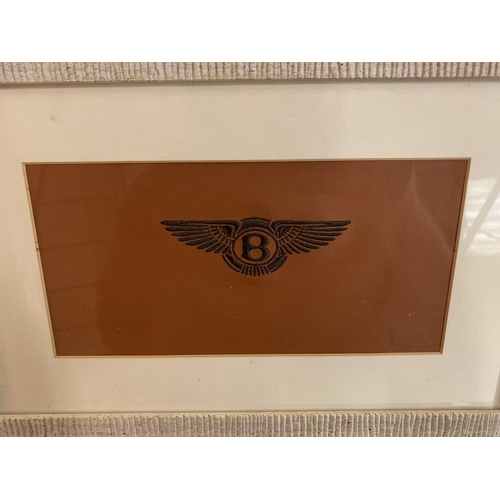 153 - A FRAMED TAN LEATHER WITH EMBROIDERED BENTLEY LOGO