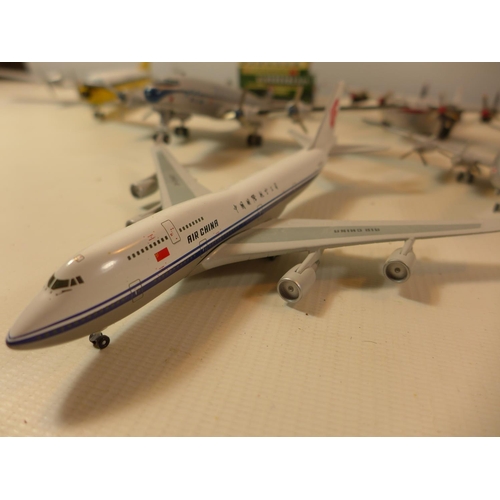 455 - SEVEN PAINTED MODEL PLANES AND A BUS