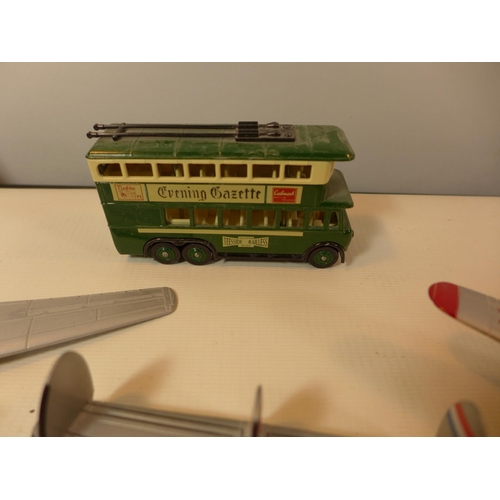 455 - SEVEN PAINTED MODEL PLANES AND A BUS